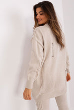 Load image into Gallery viewer, Soft knit cardigan with ribbed texture, complementing the model&#39;s casual yet stylish look.