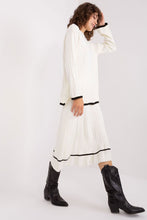 Load image into Gallery viewer, Elegant white midi dress with puff sleeves, black trim, and high-heeled black boots