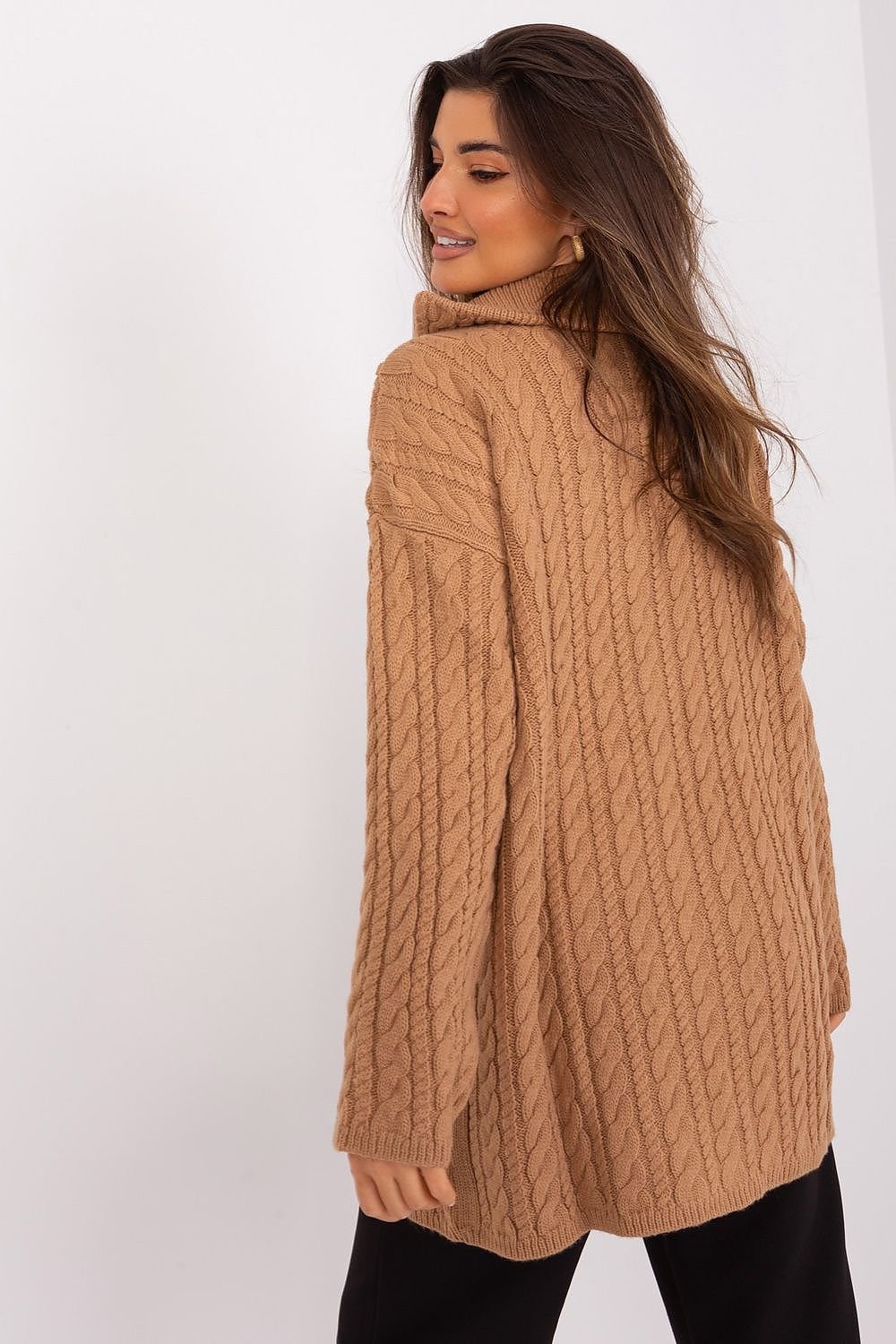 Warm cable-knit camel cardigan showcased on female model with long brown hair