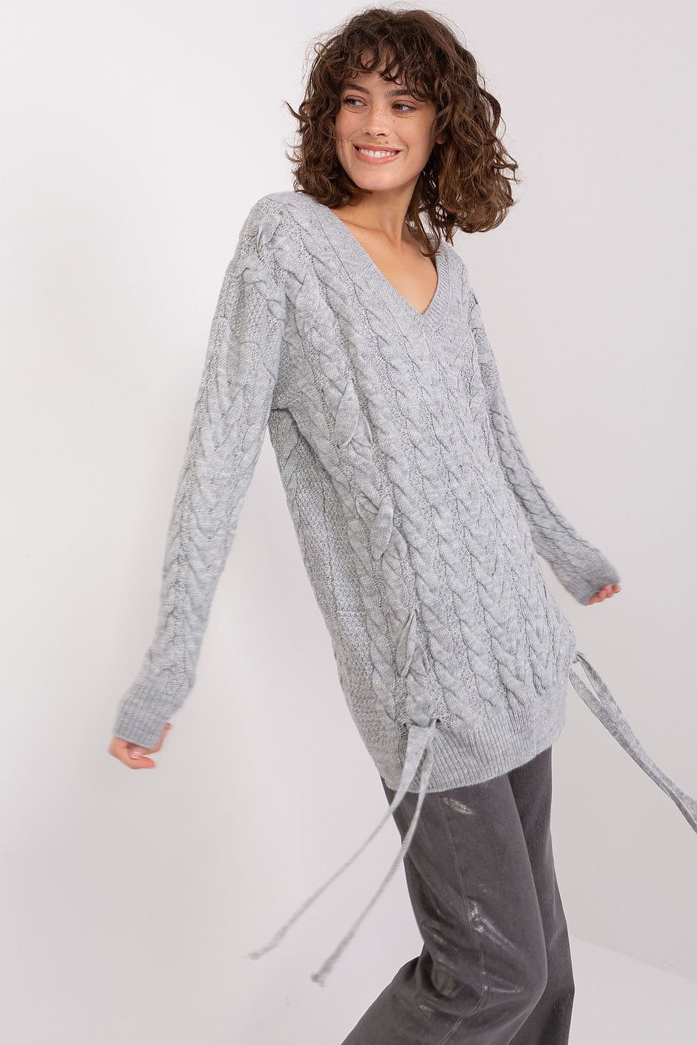 Elegant knit sweater dress with cable pattern in a soft gray hue, featuring a flattering V-neck design.