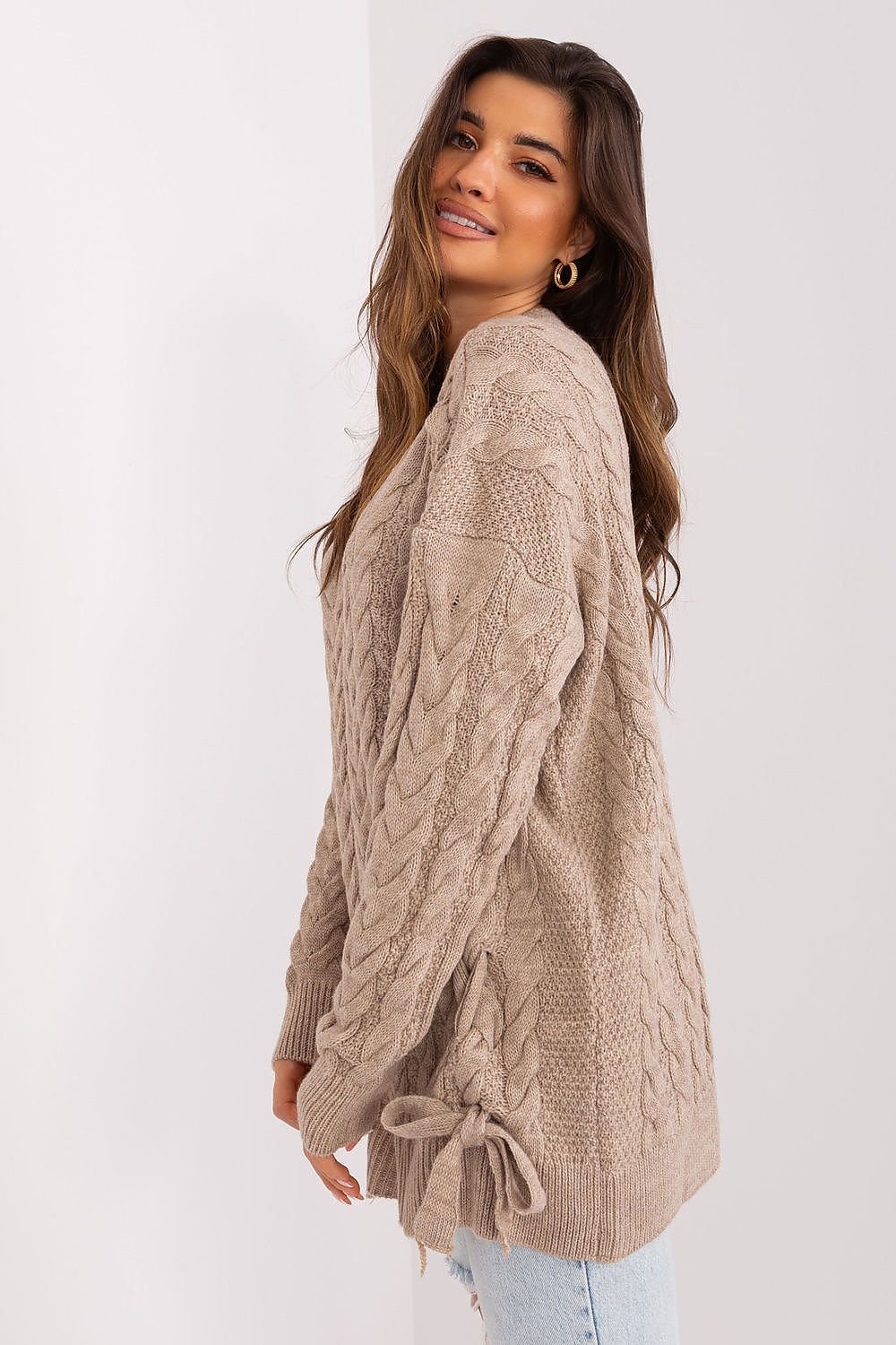 Elegant knit sweater dress by Badu featuring a cozy cable knit pattern and a relaxed fit.