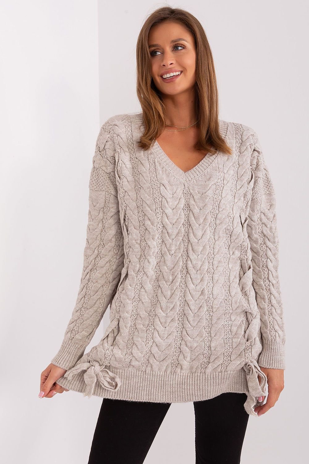 Elegant knit sweater dress by Badu - a cozy, cable-knit tunic with a flattering V-neckline and feminine silhouette, perfect for effortless fall style.