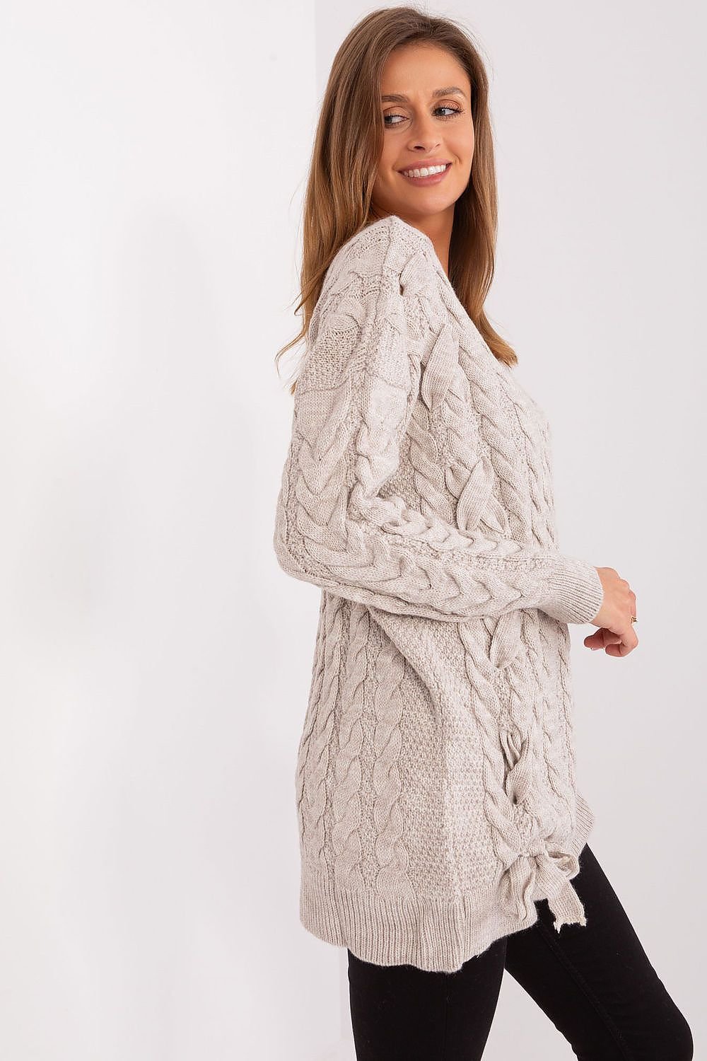 Elegant knit sweater dress by Badu featuring a cozy cable pattern, long sleeves, and a relaxed fit for a stylish yet comfortable look.