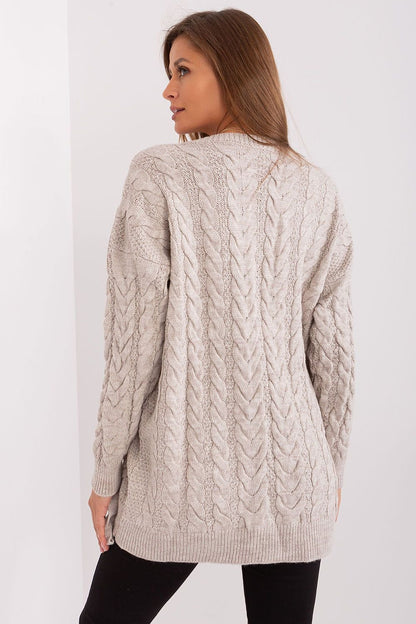 Elegant cable knit beige sweater dress by Badu, placed against a plain white background.