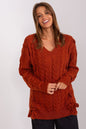 Elegant knit sweater dress by Badu - Warm, textured rust-colored sweater with a V-neck and cable knit pattern, showcased against a plain background.