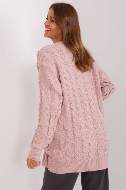 Elegant knit sweater dress by Badu: Cozy pink cable knit with stylish flared sleeves, ideal for comfortable yet chic winter style.