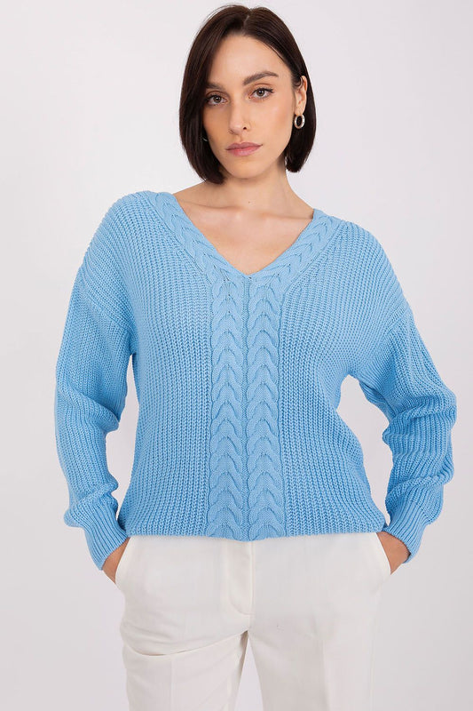 Elegant braided knit cardigan in sky blue, featuring a v-neck design and a warm, cozy textured pattern, modeled by a stylish young woman with dark hair.