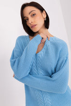 Load image into Gallery viewer, Elegant braided knit cardigan in a soothing sky blue color, showcased on a female model with dark hair against a plain white background.