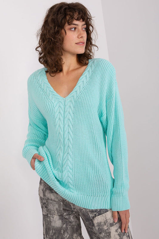 Soft turquoise knit sweater, casual style, cable knit pattern, comfortable fit, warm winter essential.