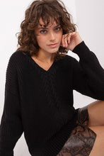 Load image into Gallery viewer, Cozy black ribbed crewneck sweater showcased on female model with curly hair