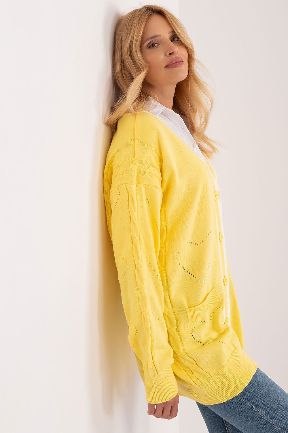 Vibrant yellow lightweight waterproof hooded raincoat showcased on female model with long blonde hair