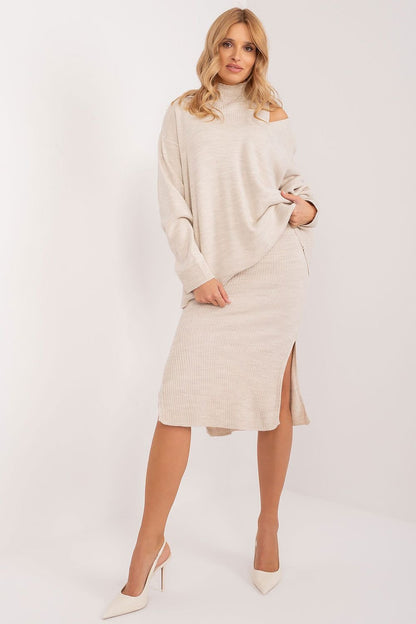 Elegant sleeveless midi dress with overlay by Badu, model posing against plain white background