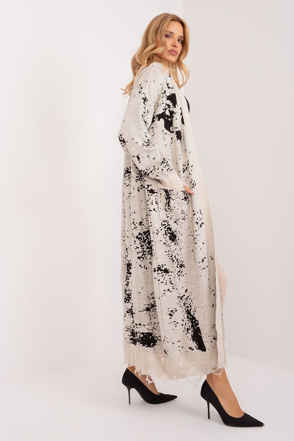 Elegant floral jacquard maxi cardigan with intricate pattern and flowing silhouette, perfect for a stylish layered look.