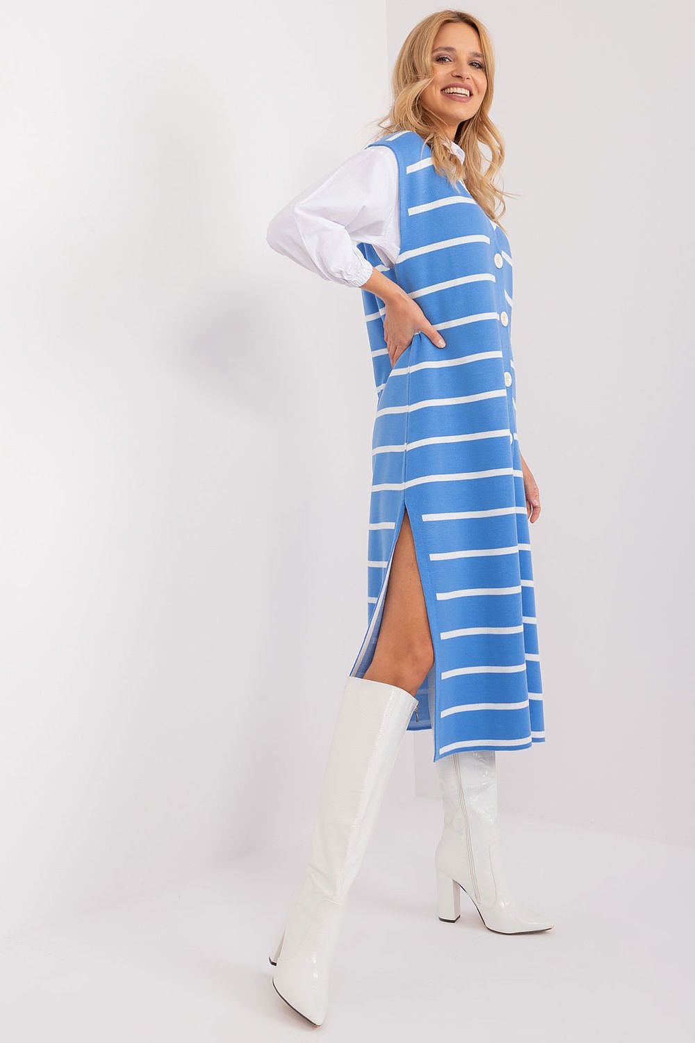 Elegant striped midi dress by Badu fashion brand, featuring chic blue and white stripes and a stylish slit design, worn by a smiling blonde woman against a clean white background.