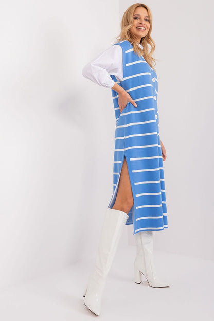 Elegant striped midi dress by Badu fashion brand, featuring chic blue and white stripes and a stylish slit design, worn by a smiling blonde woman against a clean white background.