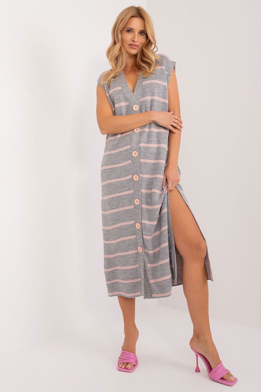 Elegant striped midi dress by Badu, featuring a sleeveless design, button-down front, and side slit for a stylish, casual look.