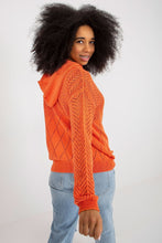 Load image into Gallery viewer, Vibrant orange crewneck sweater with intricate knit patterns, worn by a woman with curly dark hair