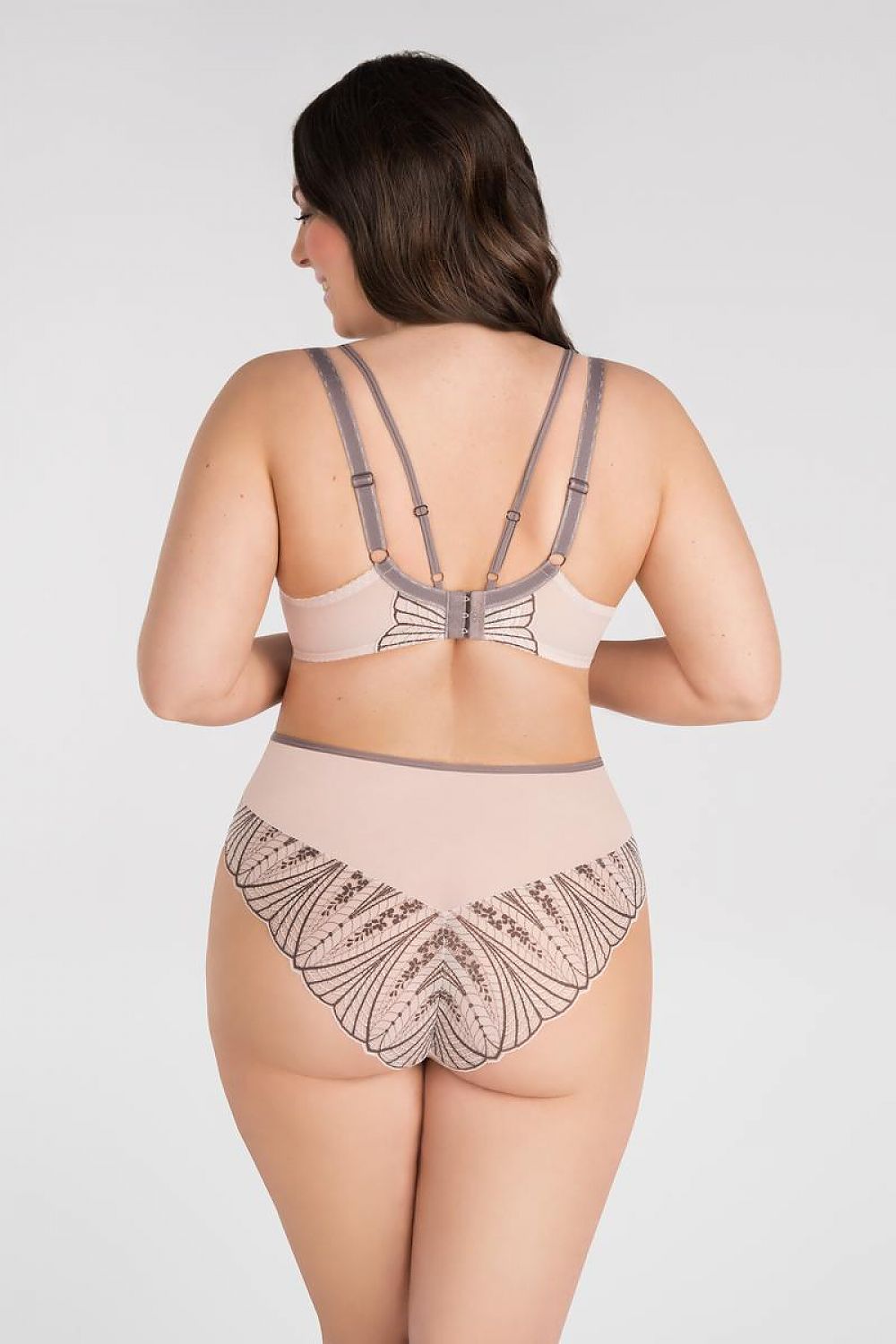 Soft beige Gorsenia Lingerie set with geometric embroidery design and adjustable straps on full-figure model.