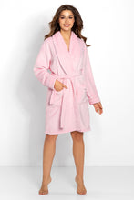 Load image into Gallery viewer, Soft pink plush bathrobe with a shawl collar, long sleeves, and pockets worn by a smiling woman against a white background.