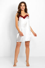 Load image into Gallery viewer, Beautiful white satin nightshirt with elegant burgundy lace trim detail on the chest, shown on a smiling model in a studio setting.