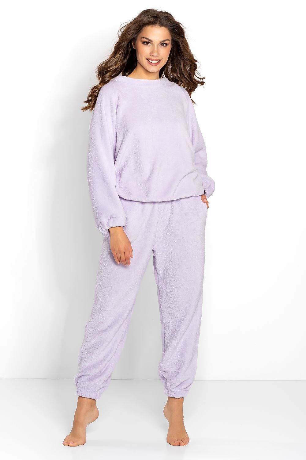 Cozy lavender loungewear set with soft textured fabric, featuring a relaxed-fit pullover sweater and matching jogger pants for comfortable and stylish leisure wear.