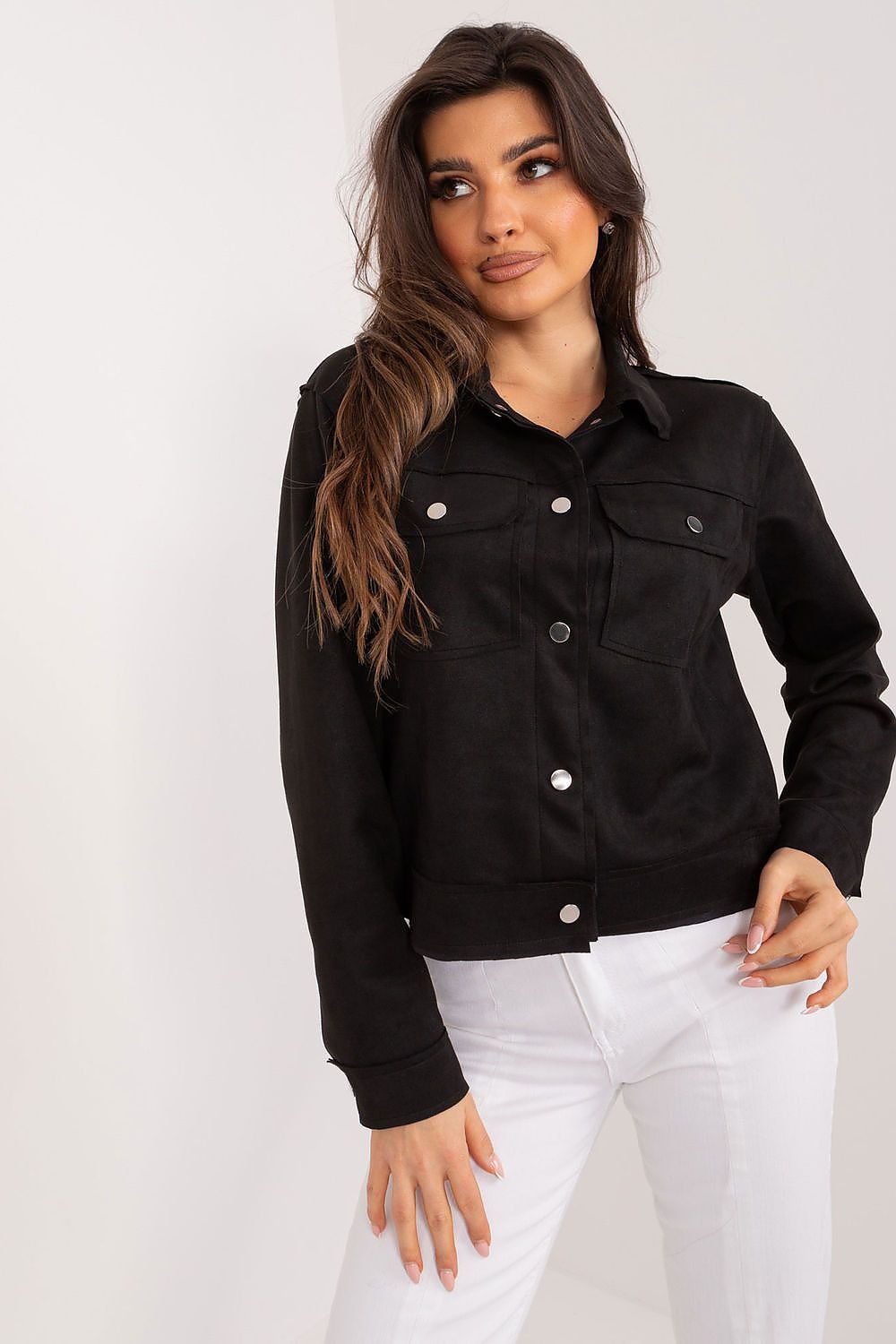 Classic Black Denim Jacket for Everyday Style
A woman wearing a button-up denim jacket with a modern, feminine silhouette.