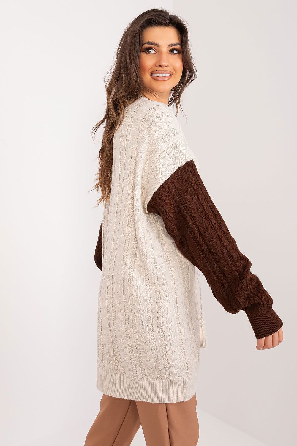 Chic faux fur trimmed cable knit sweater dress with contrasting brown and beige color blocking