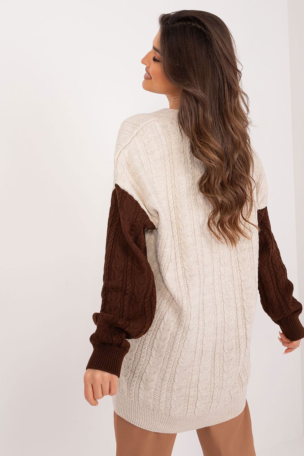 Cozy faux fur-trimmed cable knit dress with warm, rich brown color-blocking