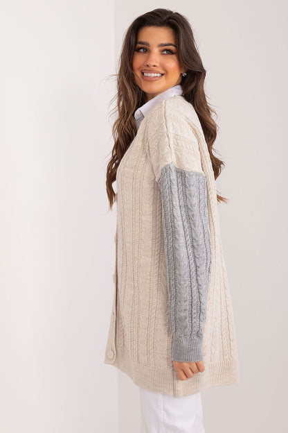 Cozy and elegant cable knit sweater with faux fur trim