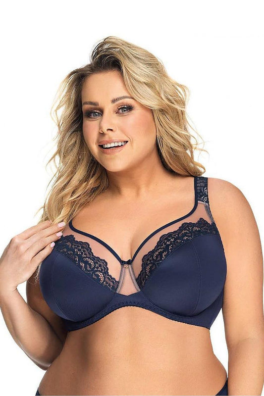 Elegant navy blue lace-trimmed plus-size Gorsenia lingerie bra modeled by a smiling blonde woman against a white background.