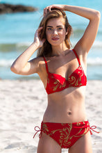 Load image into Gallery viewer, Red floral bikini on woman standing on tropical beach