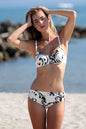 Stylish black and white two-piece swimsuit by Ewlon, featuring a flattering pattern and visible at a beachfront location.