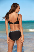 Load image into Gallery viewer, Elegant black two-piece swimsuit on woman&#39;s figure against blue ocean backdrop