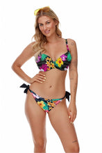 Load image into Gallery viewer, Vibrant tropical floral print bikini with adjustable bow details, perfect for a day at the beach or pool.