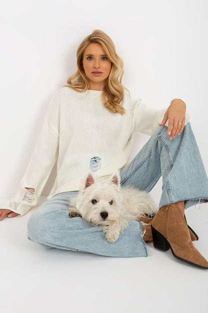 Cozy white knit jumper, casual denim, and a cute white dog - a comfortable, stylish outfit for a relaxed day.