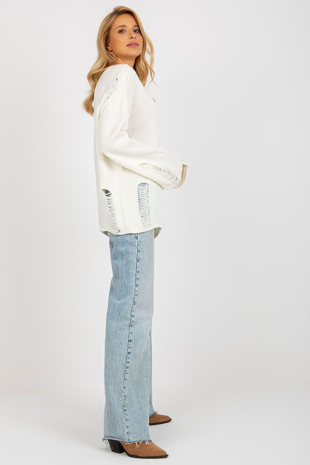 Cozy white knit jumper by Badu, featuring a relaxed fit and distressed details for a stylish casual look.