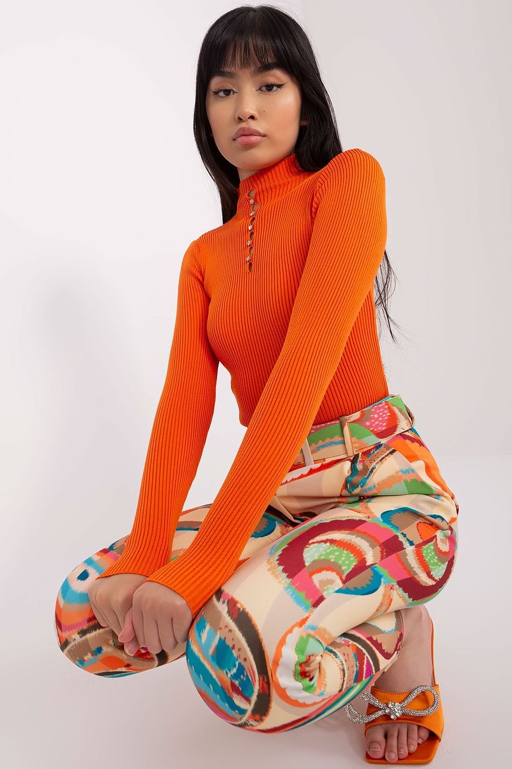 Vibrant retro-inspired ribbed knit top on young female model