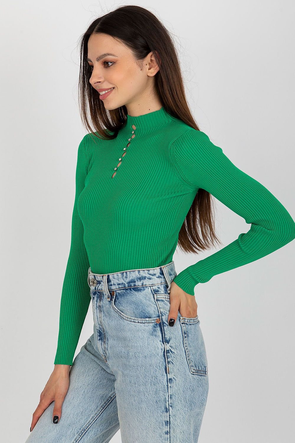 Vibrant retro-inspired ribbed knit top with long sleeves and button accent, styled with high-waisted denim jeans against a plain background.