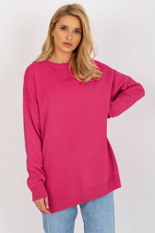 Oversized pink jumper from Badu brand, worn by a female model with long blonde hair against a white background.