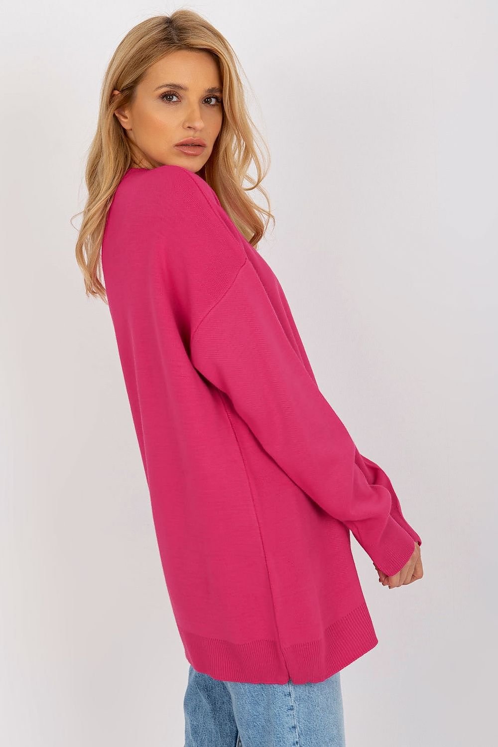 Vibrant fuchsia womens jumper by Badu brand, featuring a relaxed silhouette and soft textured fabric for casual comfort.