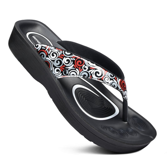 Stylish women's comfort casual slippers with a swirling pattern design on the straps. The black and red color scheme creates a modern, eye-catching look. These slip-on sandals feature a contoured footbed for all-day support and comfort.