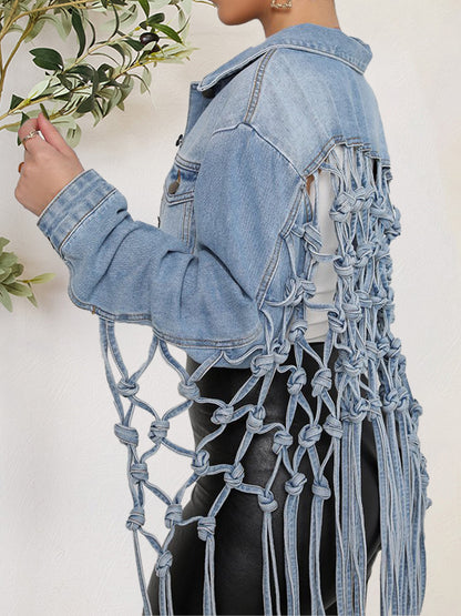 Stylish denim jacket with fringe details and pockets, displaying fashion-forward design.