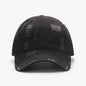 Adjustable distressed black cotton baseball cap with a structured design and textured fabric