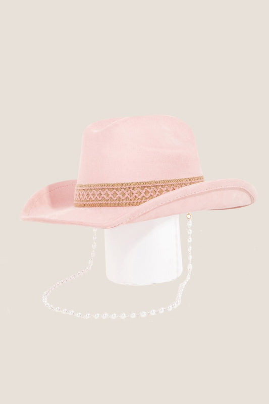 Elegant pink cowboy hat with ornate golden band