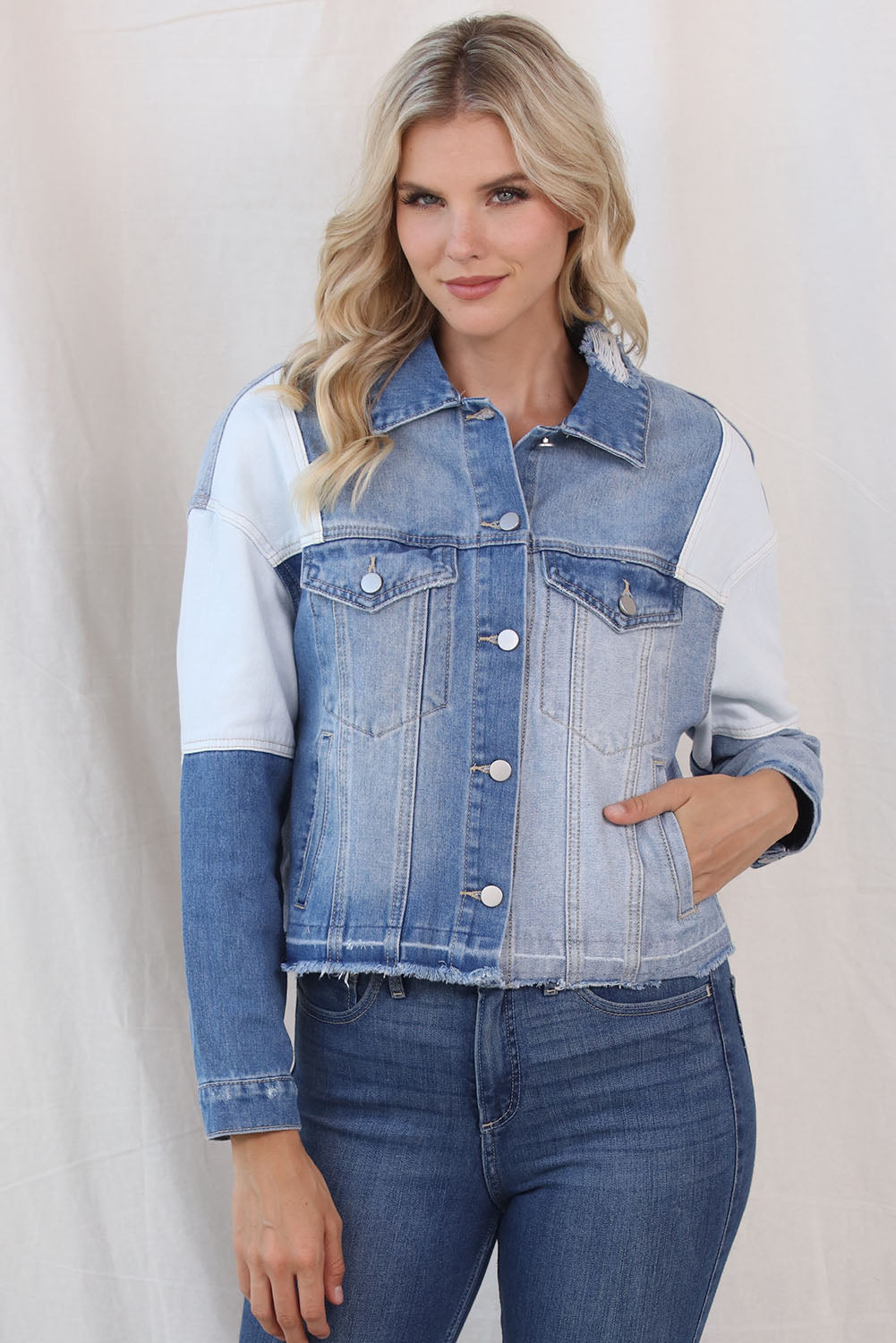 Color Block Distressed Button Up Denim Jacket - Stylish denim jacket with contrast panels and fringed edges, perfect for casual chic looks.