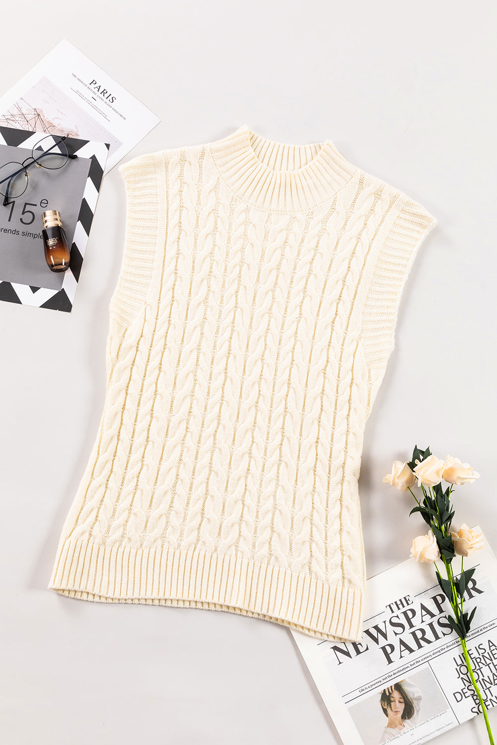 Cozy oatmeal cable knit high neck sweater vest, perfect for layering casual chic looks.