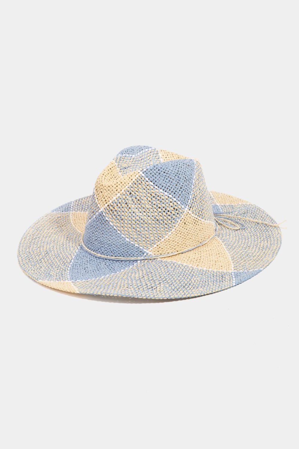 Stylish straw hat with contrasting panels in neutral tones, perfect accessory for summer wardrobes.