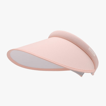 Stylish wide-brim PVC sun hat in a soft pink hue. The hat features a ribbed texture and a curved, elevated design for fashionable sun protection.