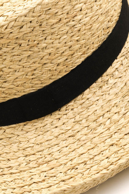 Elegant straw wide-brimmed hat with black band detail