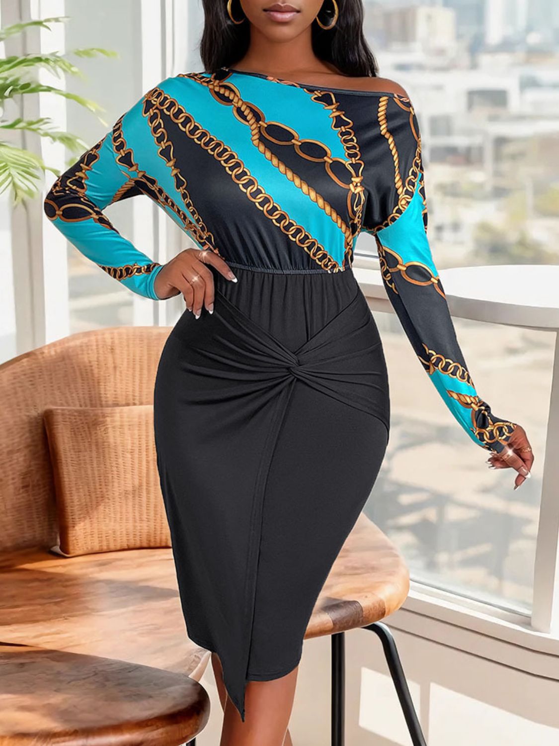 Stylish printed blouse and black midi skirt, chain and geometric patterns, woman standing by window